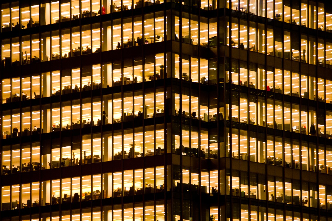 529555051 People work in an office building. Full-time employees in the UK work longer hours than the EU average, according to the Office for National Statistics.